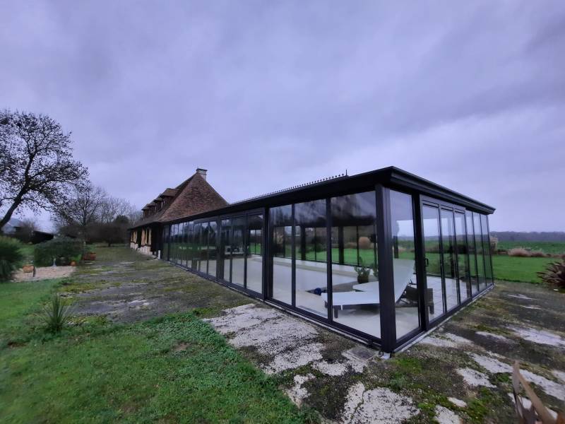 Nettoyage de la vitrerie d'une véranda